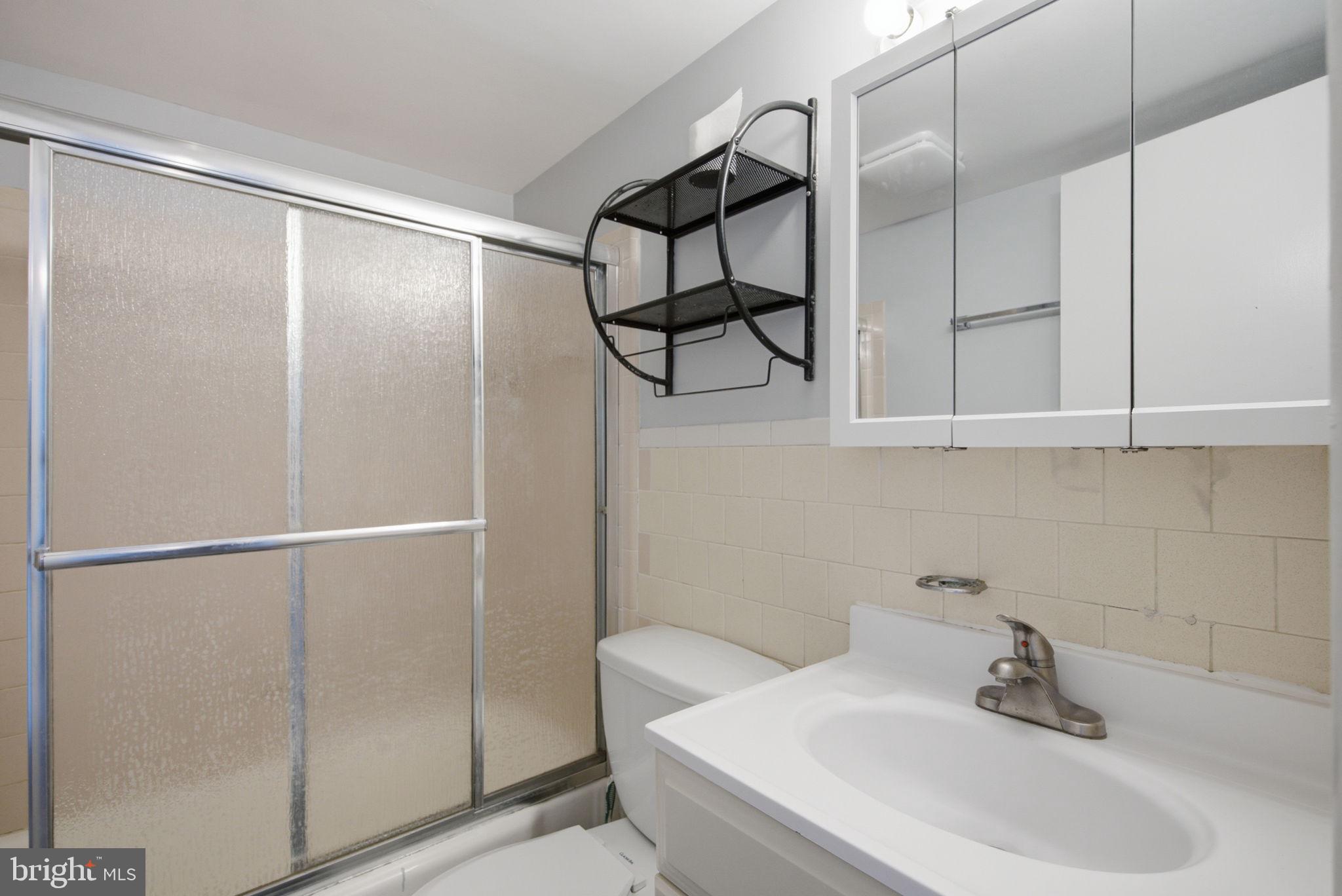 1822 Metzerott Road, Unit 103 Hyattsville, MD 20783 - Photo 15 of 25 Full bath with tub, shower, and vanity