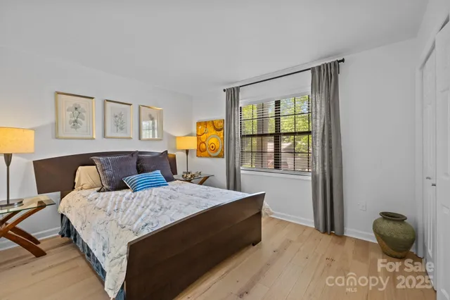 a bedroom with a bed and window