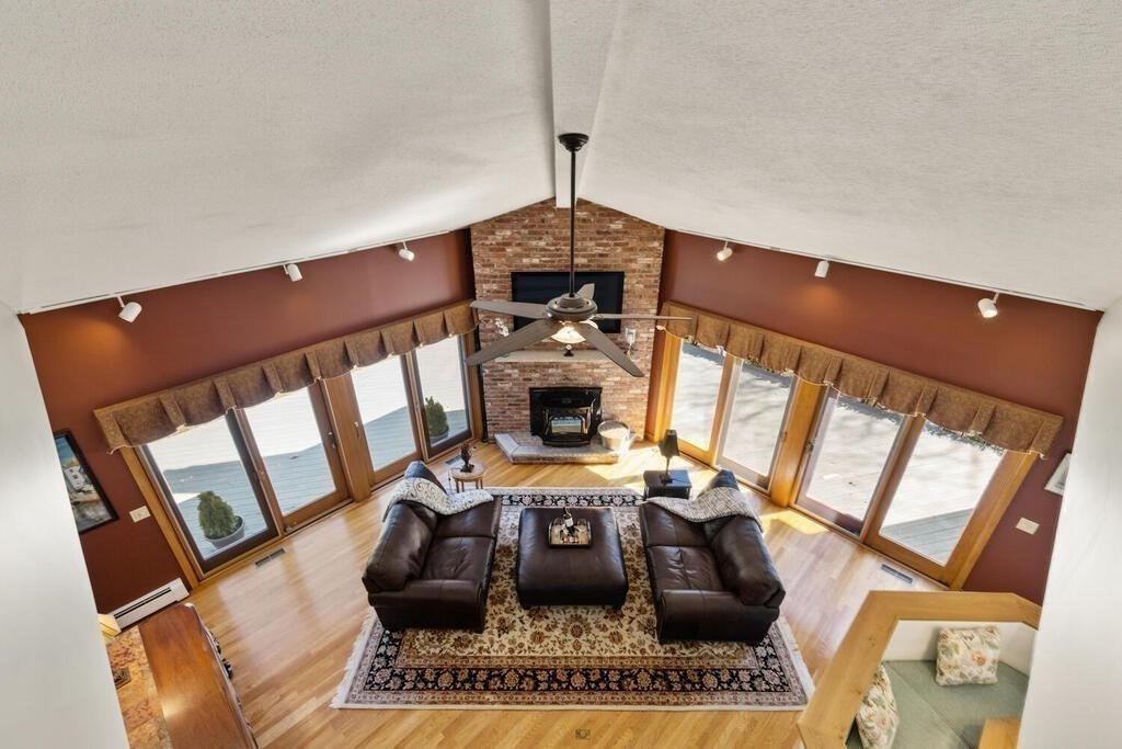 18 Appleton Lane Boxford, MA 01921 - Photo 12 of 42 a living room with furniture and a fireplace