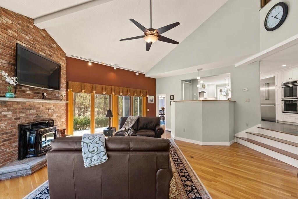 18 Appleton Lane Boxford, MA 01921 - Photo 15 of 42 a living room with furniture fireplace and a flat screen tv