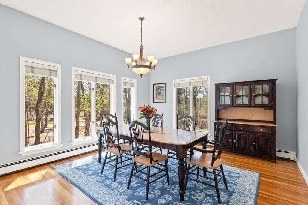 18 Appleton Lane Boxford, MA 01921 - Photo 16 of 42 a view of a dining room with furniture window and wooden floor