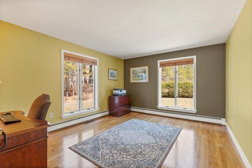 18 Appleton Lane Boxford, MA 01921 - Photo 18 of 42 a living room with furniture and a rug