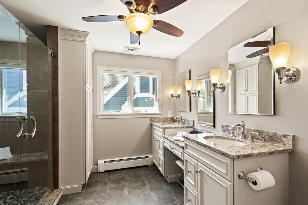 18 Appleton Lane Boxford, MA 01921 - Photo 22 of 42 a bathroom with a granite countertop sink a mirror and a shower