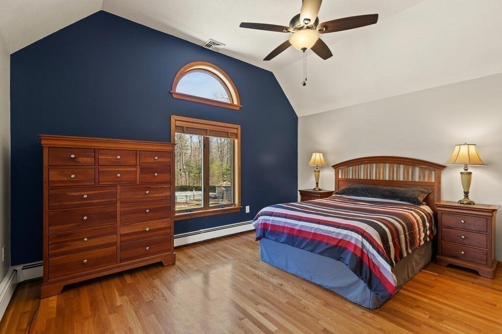 18 Appleton Lane Boxford, MA 01921 - Photo 23 of 42 a bedroom with a bed and a dresser