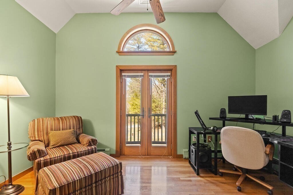 18 Appleton Lane Boxford, MA 01921 - Photo 25 of 42 a living room with a couch a rug a lamp and a window