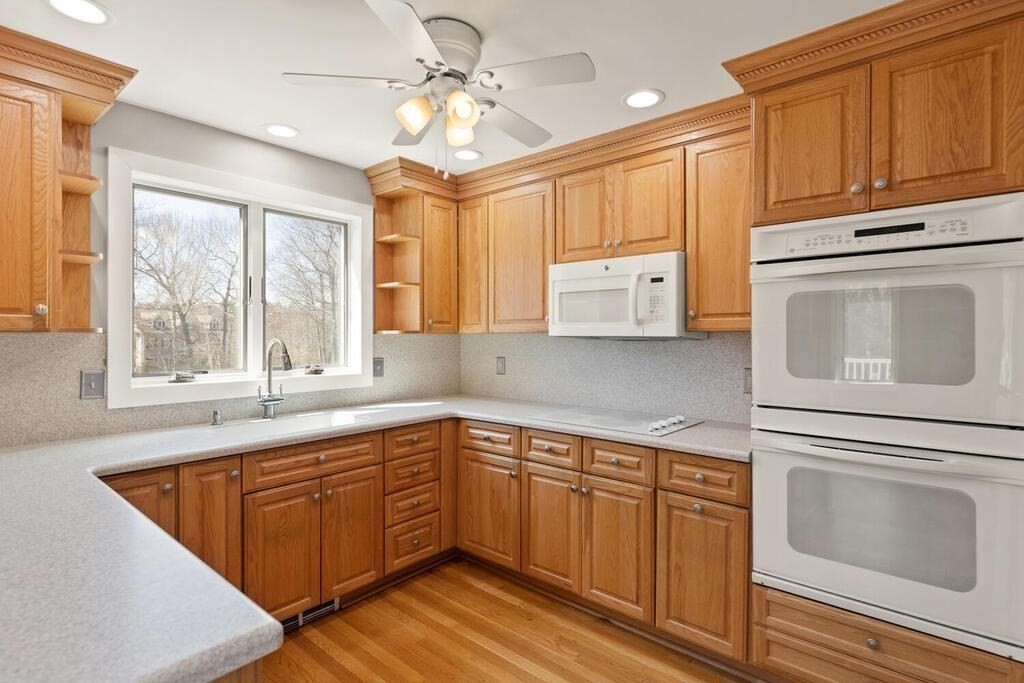 18 Appleton Lane Boxford, MA 01921 - Photo 30 of 42 a kitchen with a sink window and cabinets