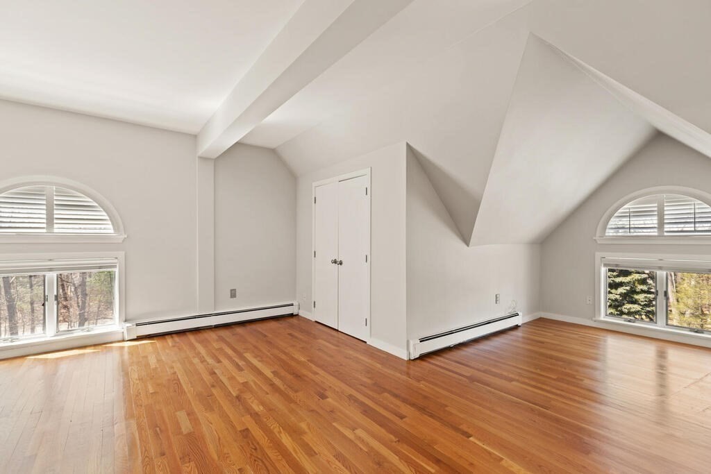 18 Appleton Lane Boxford, MA 01921 - Photo 33 of 42 an empty room with wooden floor cabinet and windows