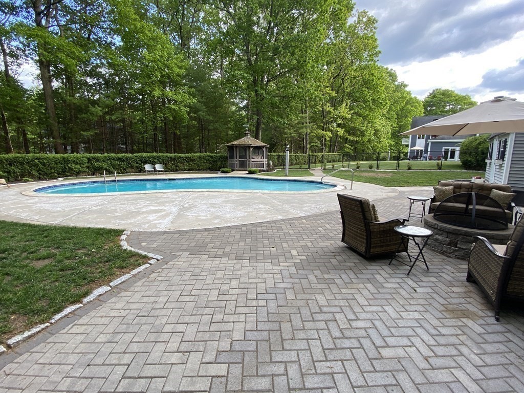 18 Appleton Lane Boxford, MA 01921 - Photo 40 of 42 a view of a patio with a table and chairs