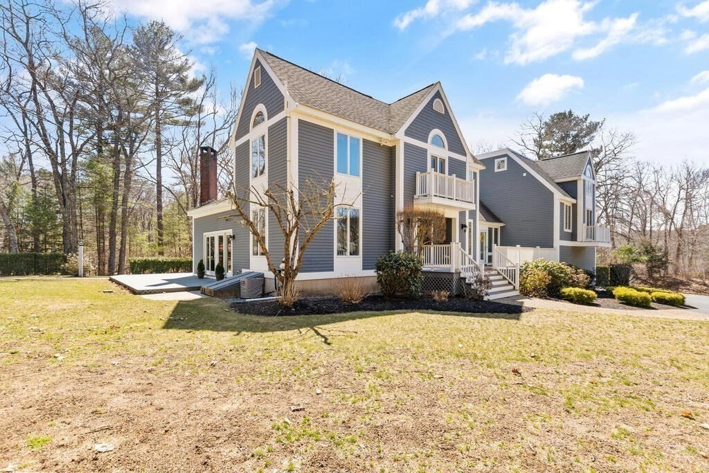 18 Appleton Lane Boxford, MA 01921 - Photo 4 of 42 a front view of a house with a yard covered with snow