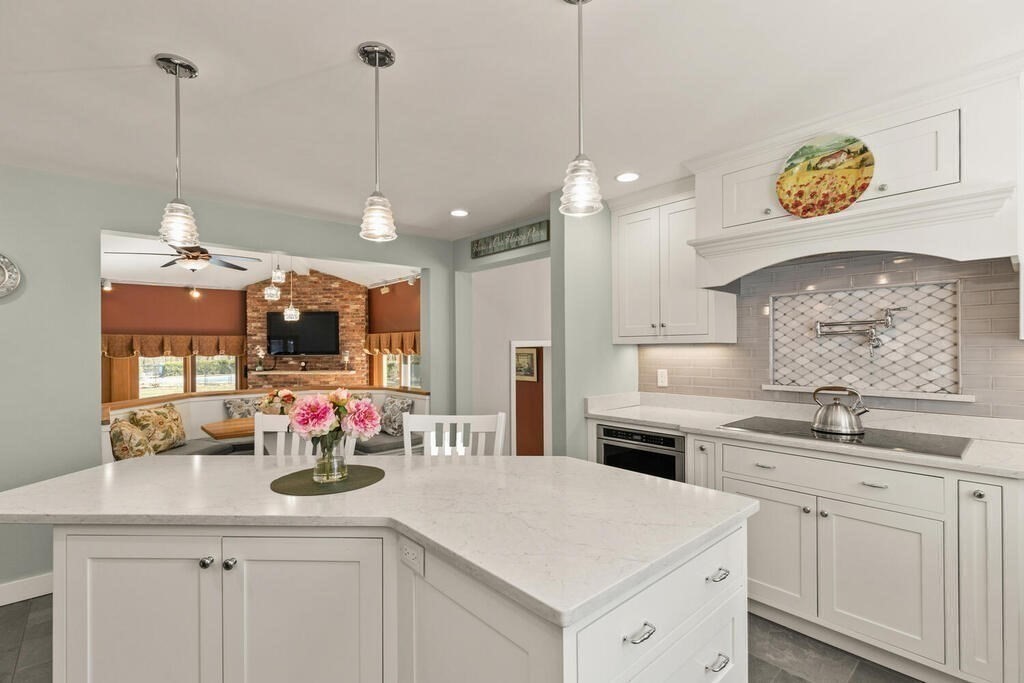 18 Appleton Lane Boxford, MA 01921 - Photo 10 of 42 a kitchen with stainless steel appliances a sink a stove a refrigerator and cabinets