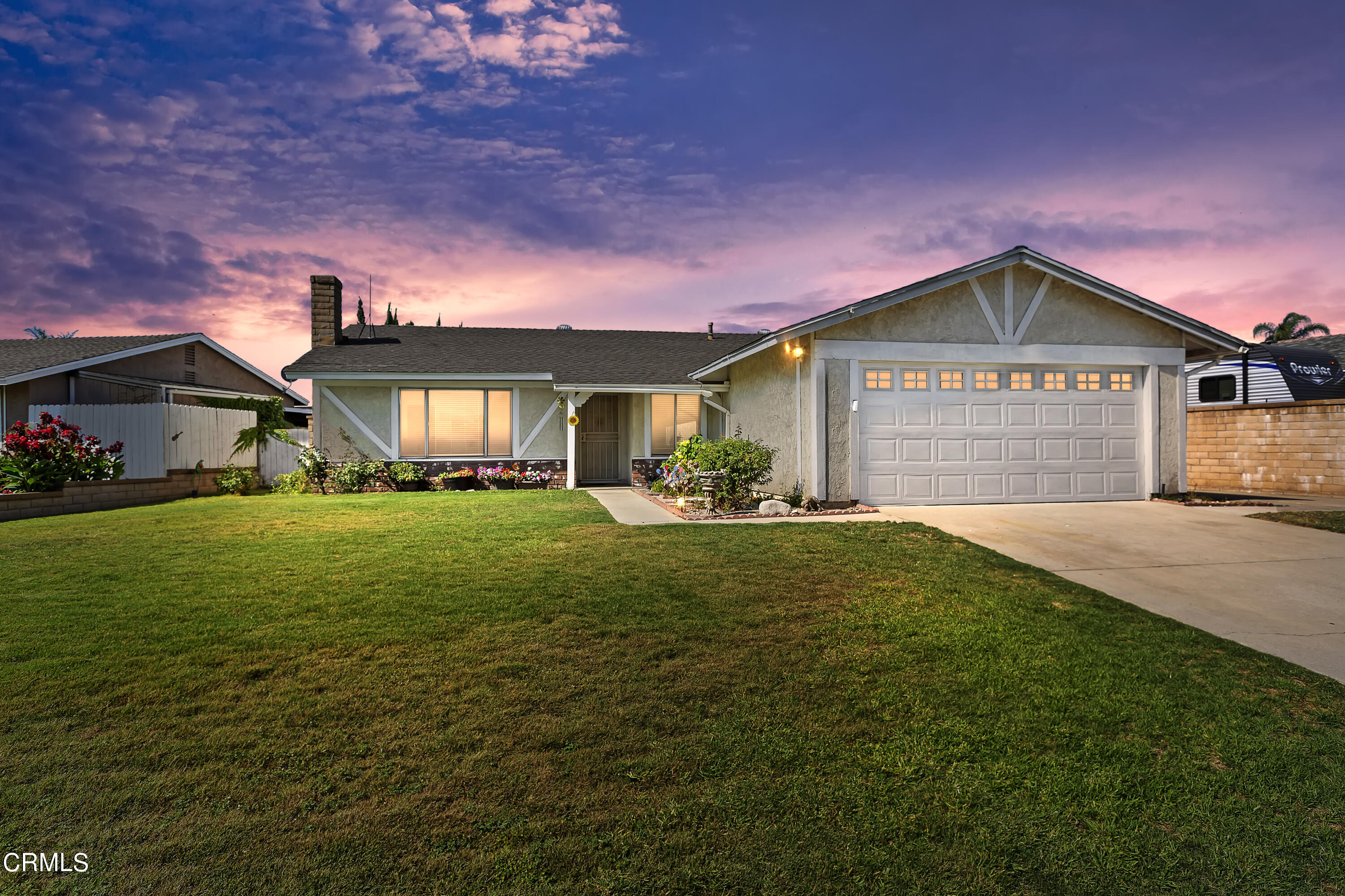 9245 Devon Street Rancho Cucamonga, CA 91730 - Photo 1 of 22 a front view of a house with a yard and garage