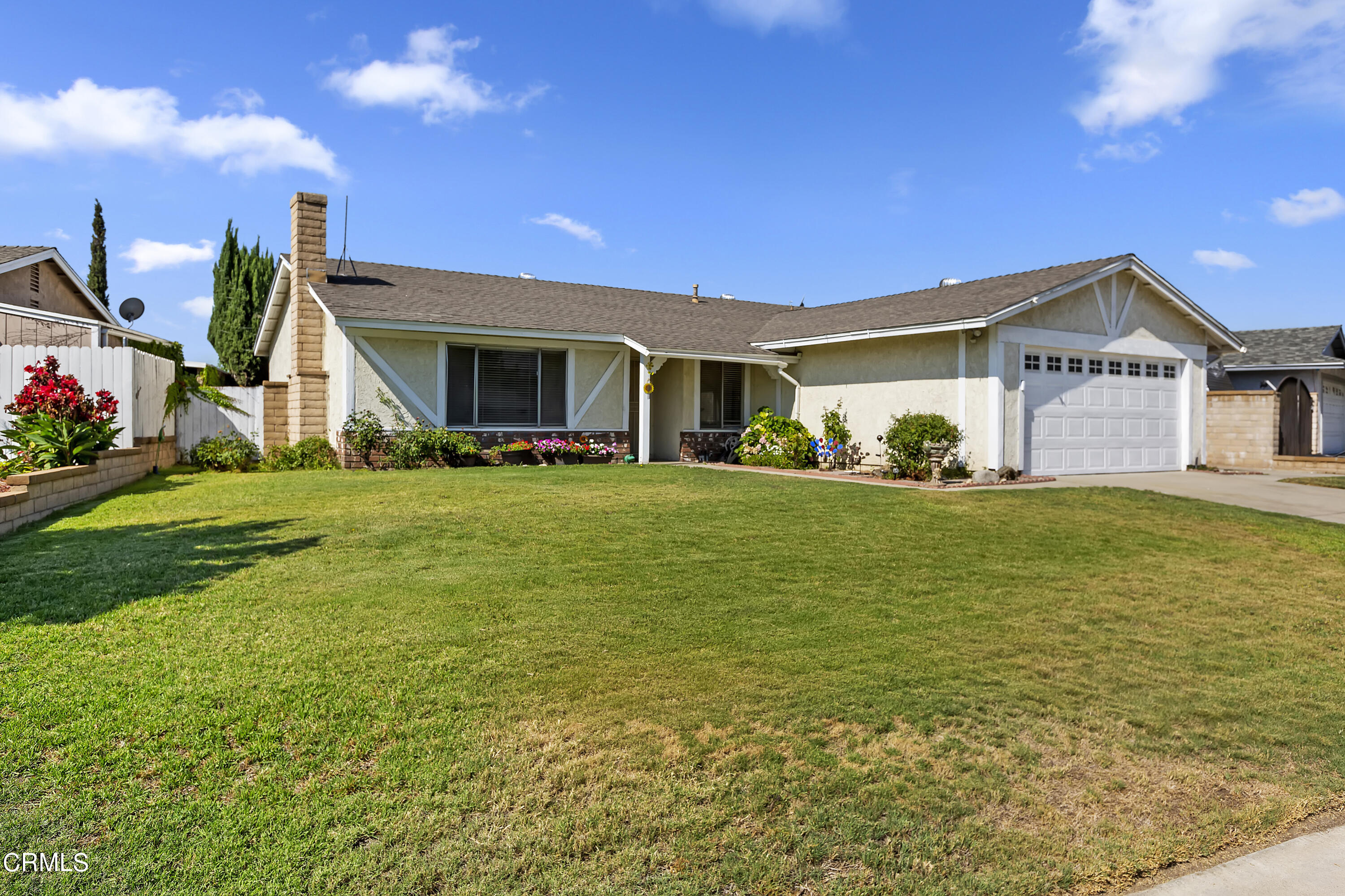 9245 Devon Street Rancho Cucamonga, CA 91730 - Photo 2 of 22 a view of a house with a yard