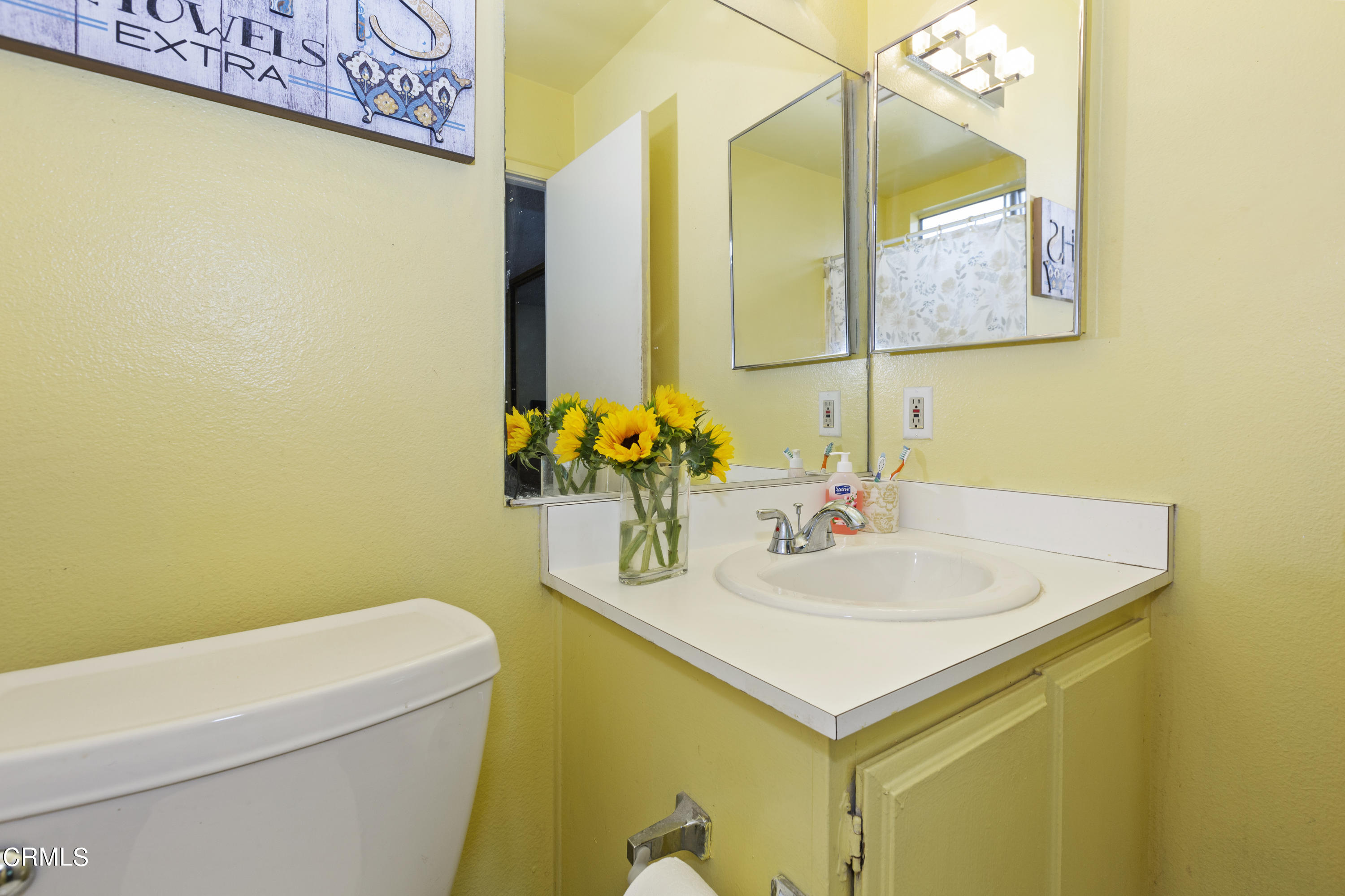 9245 Devon Street Rancho Cucamonga, CA 91730 - Photo 11 of 22 a bathroom with a sink and a mirror