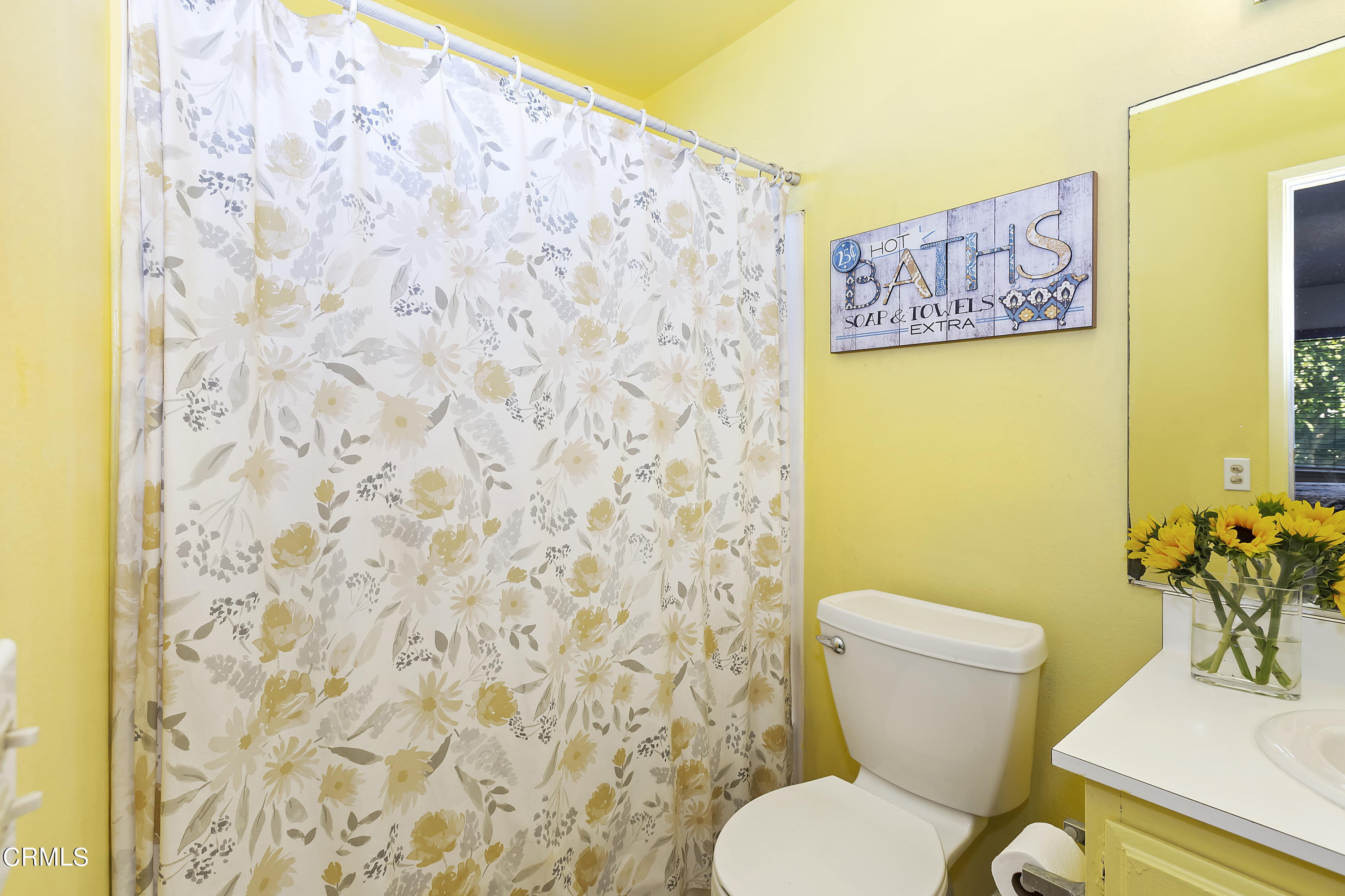 9245 Devon Street Rancho Cucamonga, CA 91730 - Photo 12 of 22 a white toilet sitting next to a bathroom sink