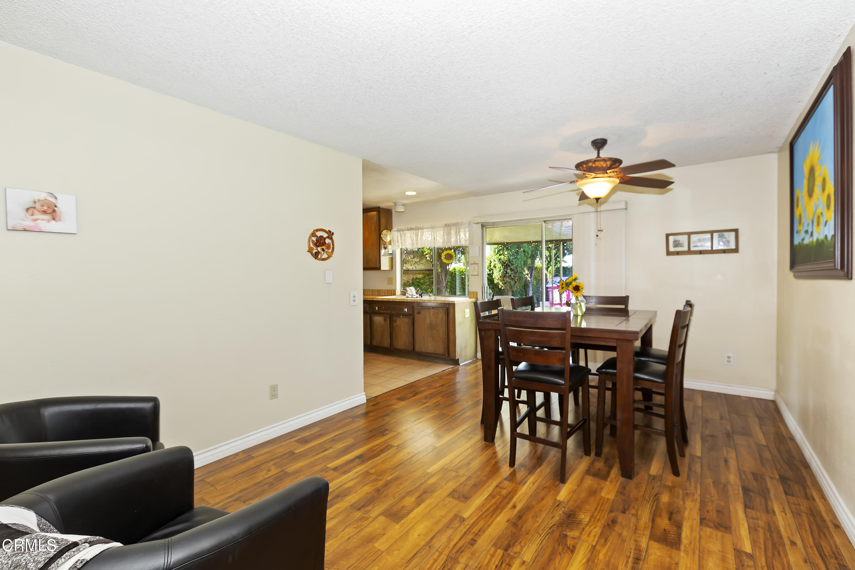 9245 Devon Street Rancho Cucamonga, CA 91730 - Photo 15 of 22 a view of a dining room with furniture and wooden floor