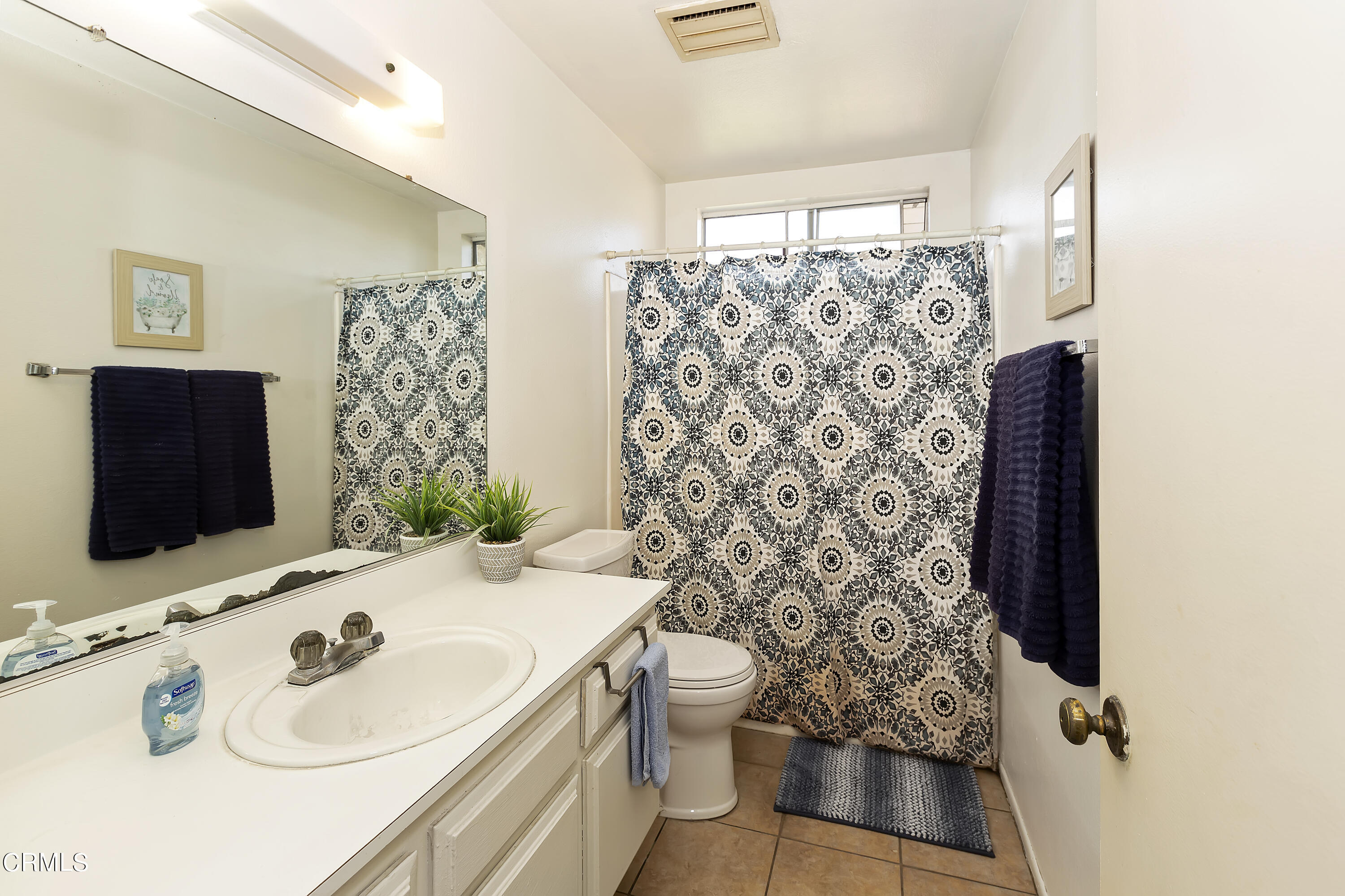 9245 Devon Street Rancho Cucamonga, CA 91730 - Photo 18 of 22 a bathroom with a sink toilet and shower