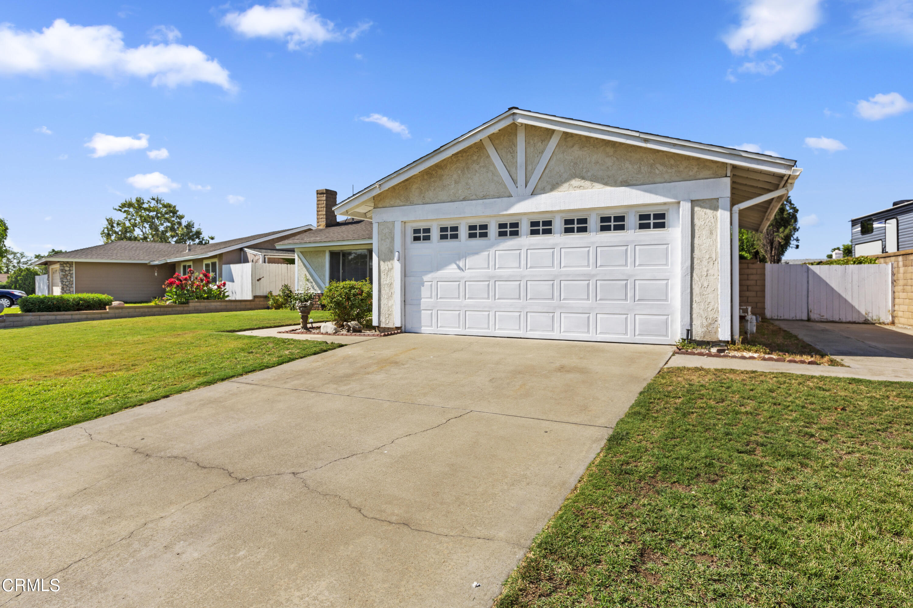 9245 Devon Street Rancho Cucamonga, CA 91730 - Photo 3 of 22 a view of a house with a yard