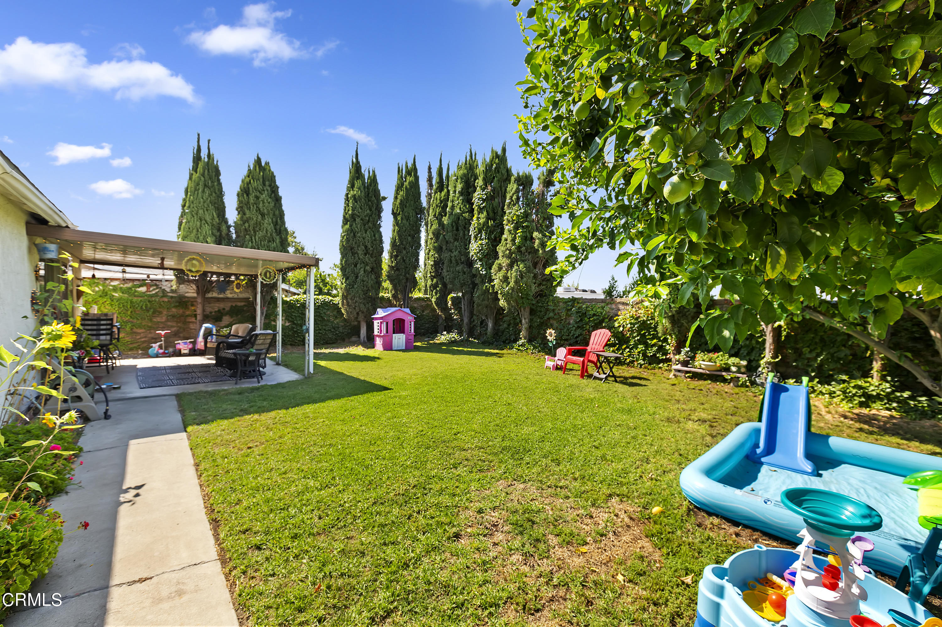 9245 Devon Street Rancho Cucamonga, CA 91730 - Photo 21 of 22 a view of yard with swimming pool and green space