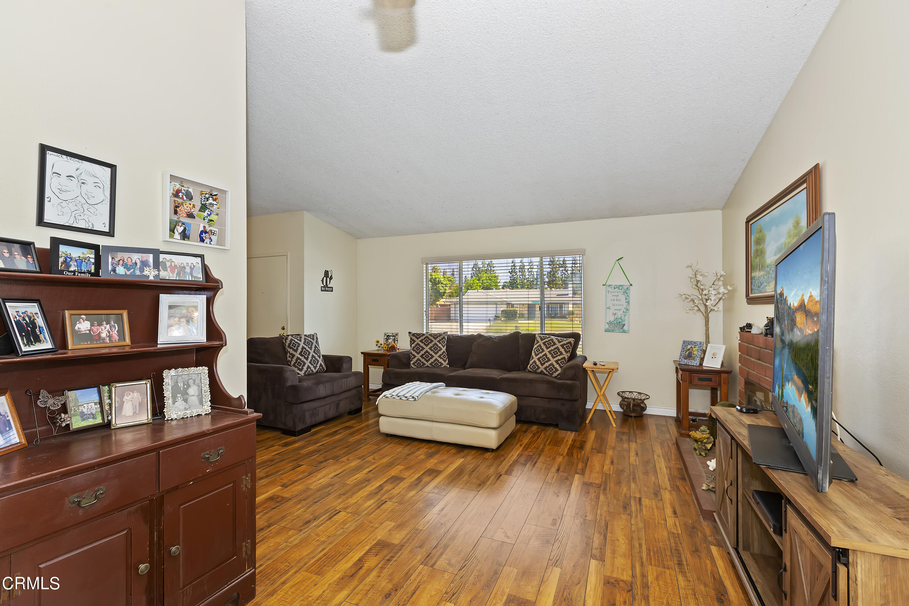 9245 Devon Street Rancho Cucamonga, CA 91730 - Photo 5 of 22 a living room with furniture and a flat screen tv