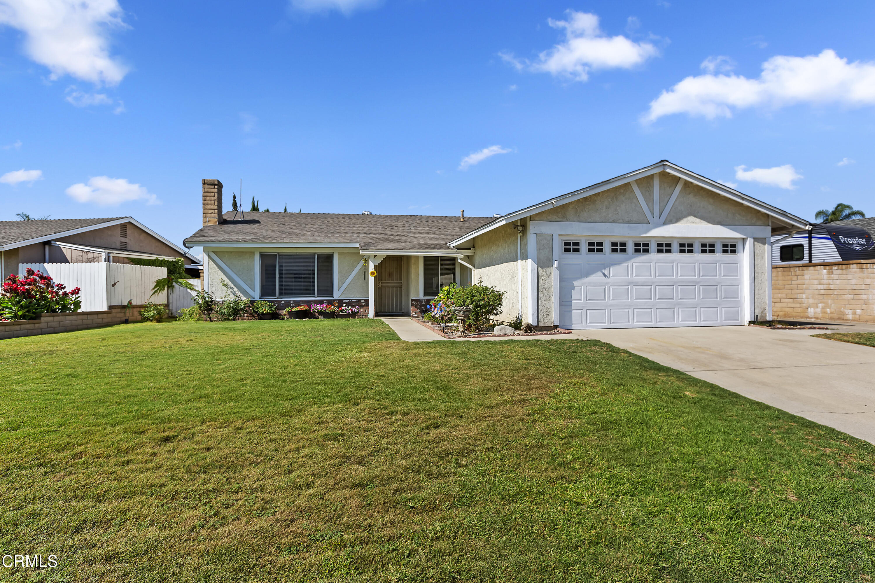9245 Devon Street Rancho Cucamonga, CA 91730 - Photo 6 of 22 a front view of a house with a yard