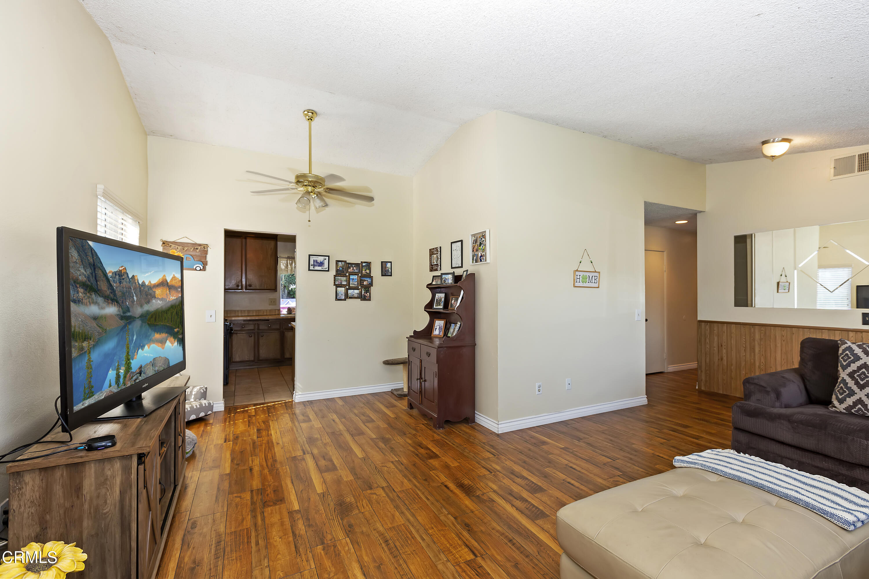 9245 Devon Street Rancho Cucamonga, CA 91730 - Photo 7 of 22 a living room with furniture and a flat screen tv