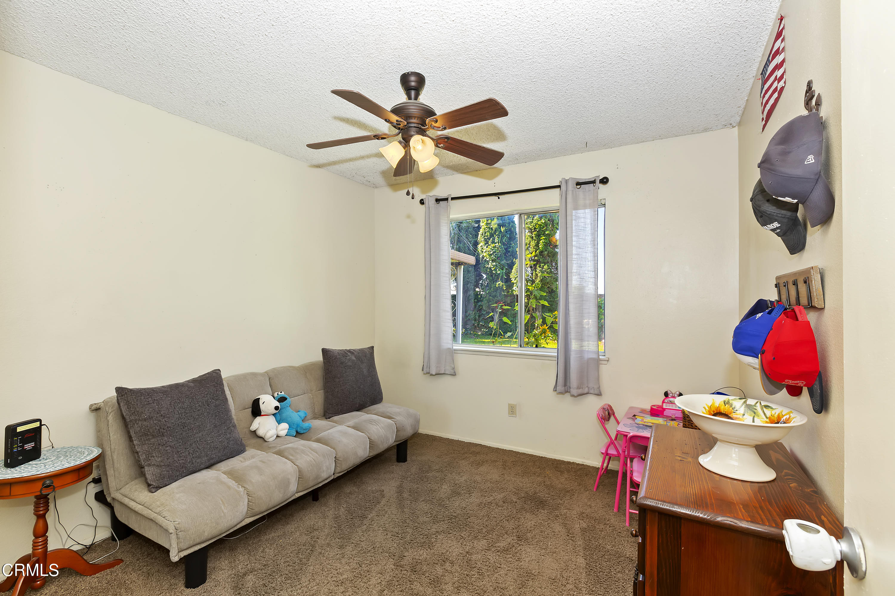 9245 Devon Street Rancho Cucamonga, CA 91730 - Photo 10 of 22 a living room with furniture and a window