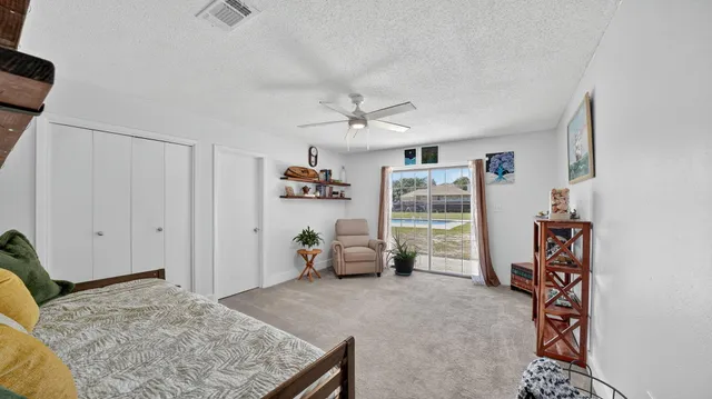 a view of walk in closet with clothes