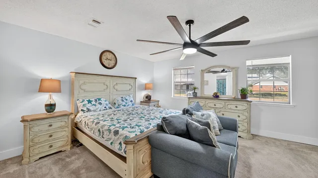 a view of a swimming pool with an outdoor space and seating area