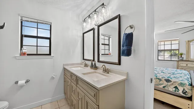 a view of a yard with wooden fence