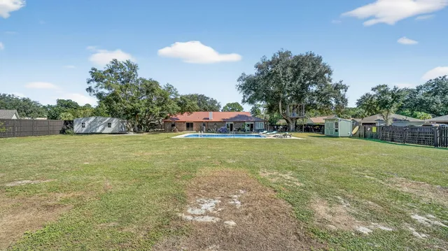 an aerial view of a house with a garden