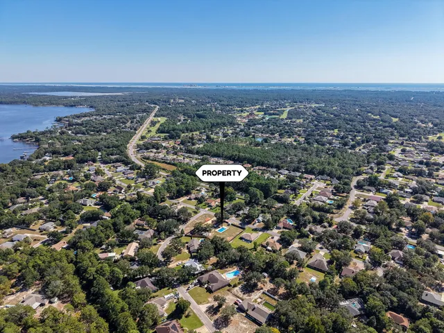 an aerial view of residential houses with outdoor space