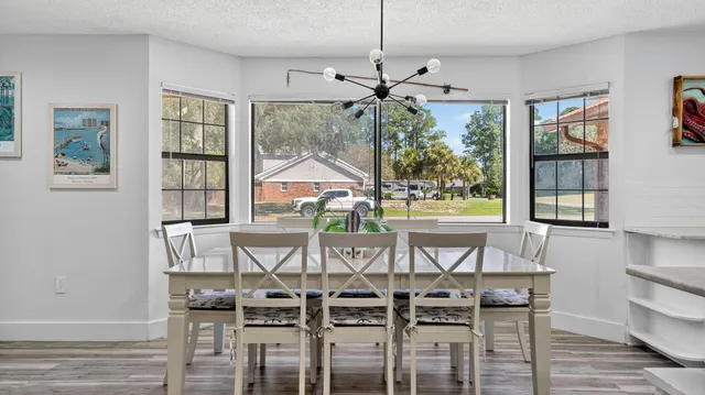 a view of a dining room with furniture window and outside view