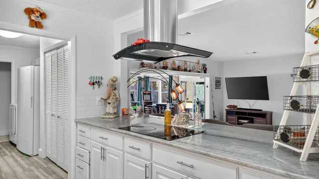 a view of living room with furniture and flat screen tv