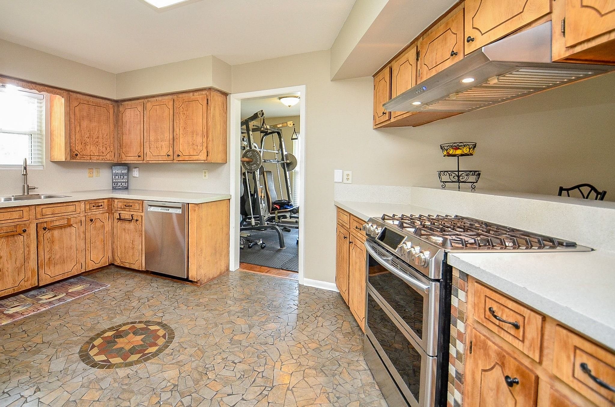 2500 County Road 62 Rosharon, TX 77583 - Photo 19 of 48 a kitchen with stainless steel appliances granite countertop a stove a sink and a refrigerator