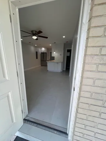 a view of a hallway with staircase