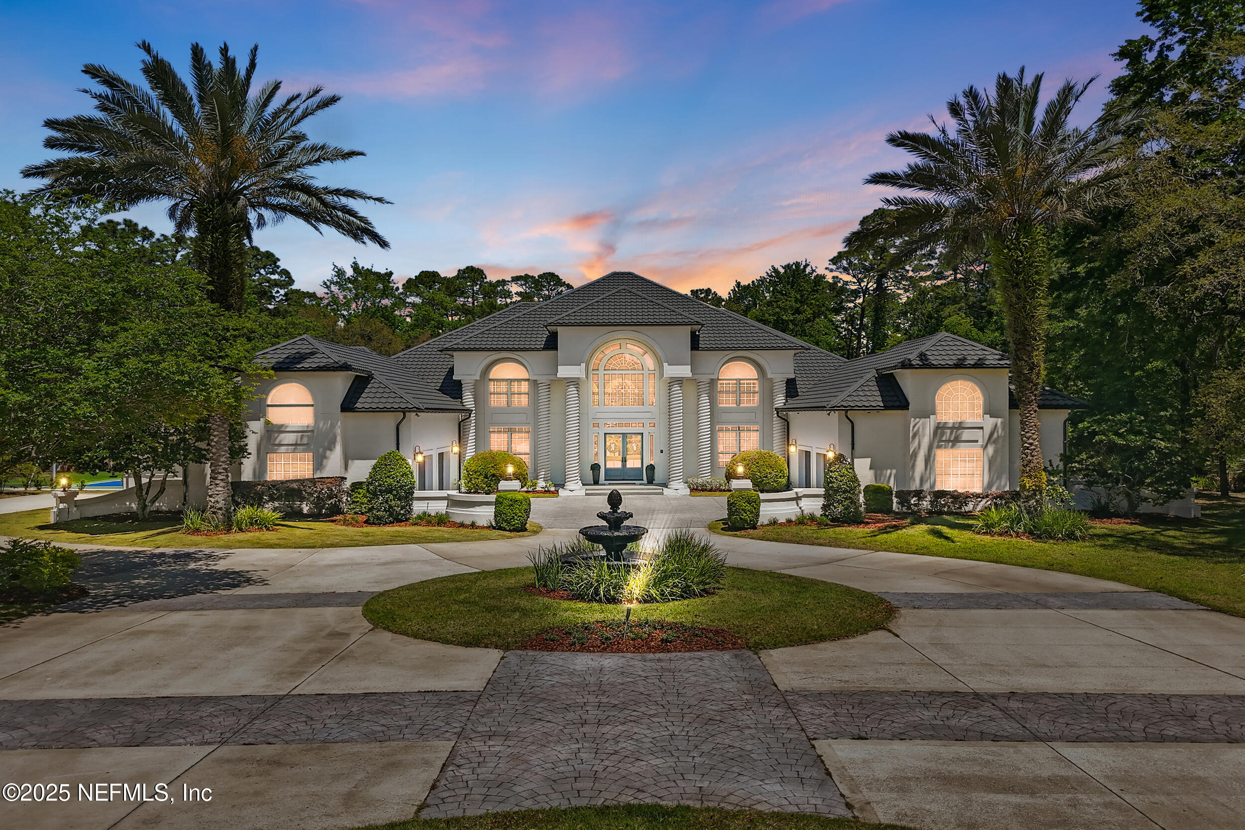 8007 Acorn Ridge Road Jacksonville, FL 32256 - Photo 2 of 76 a front view of a house with garden and trees