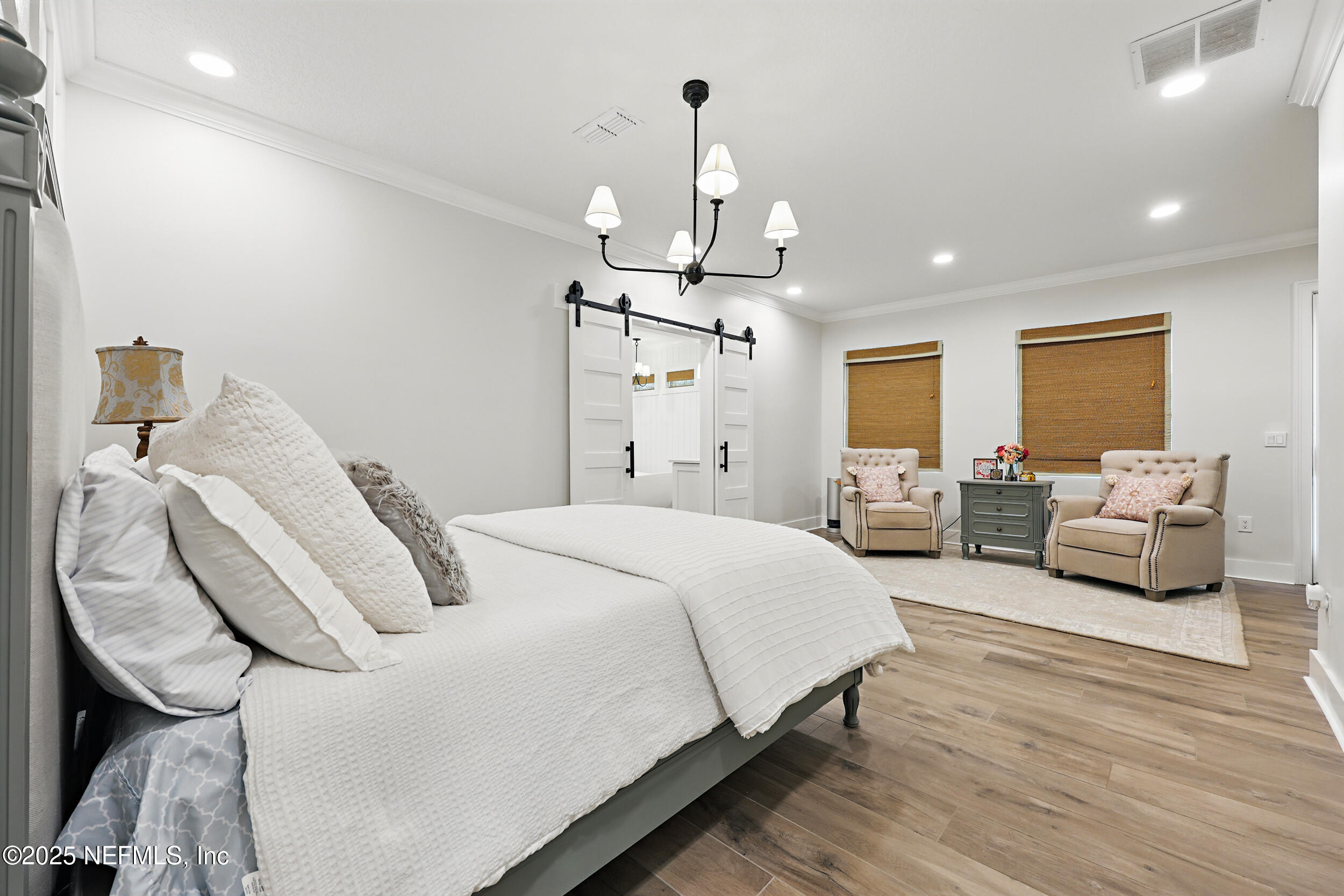 8007 Acorn Ridge Road Jacksonville, FL 32256 - Photo 34 of 76 a spacious bedroom with a bed and furniture