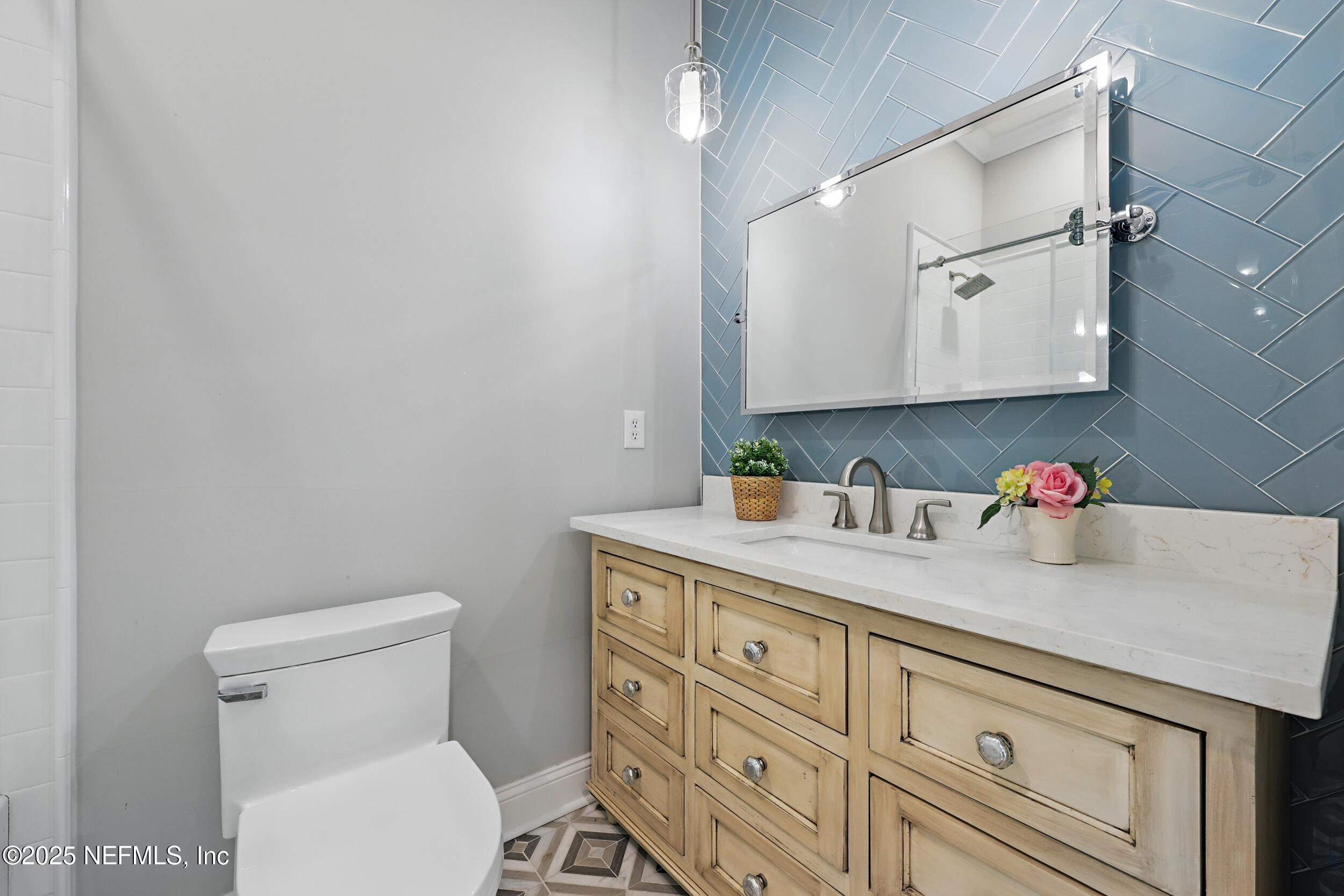 8007 Acorn Ridge Road Jacksonville, FL 32256 - Photo 46 of 76 a bathroom with a granite countertop sink and a toilet