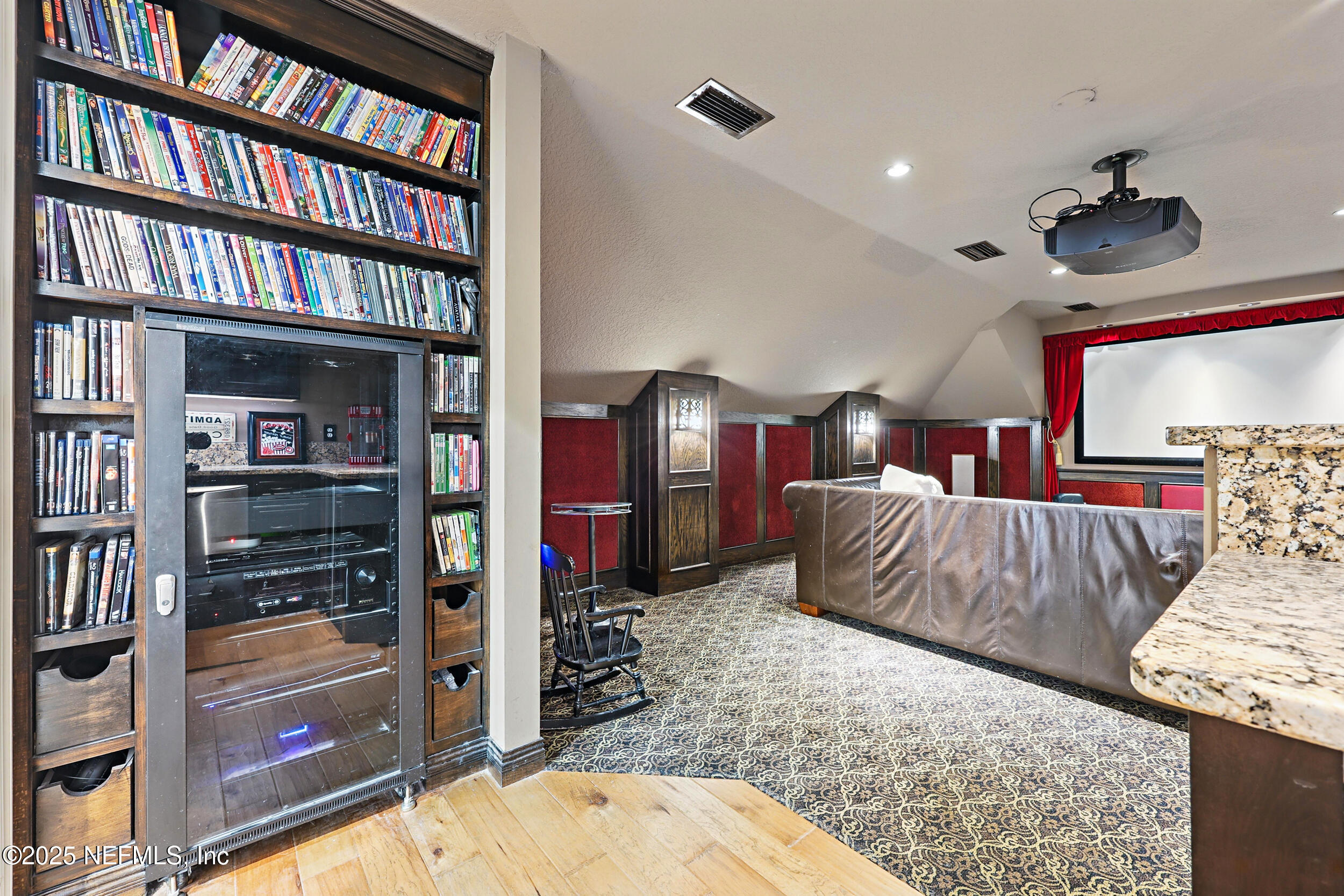 8007 Acorn Ridge Road Jacksonville, FL 32256 - Photo 49 of 76 a bedroom with a large bed and a book shelf