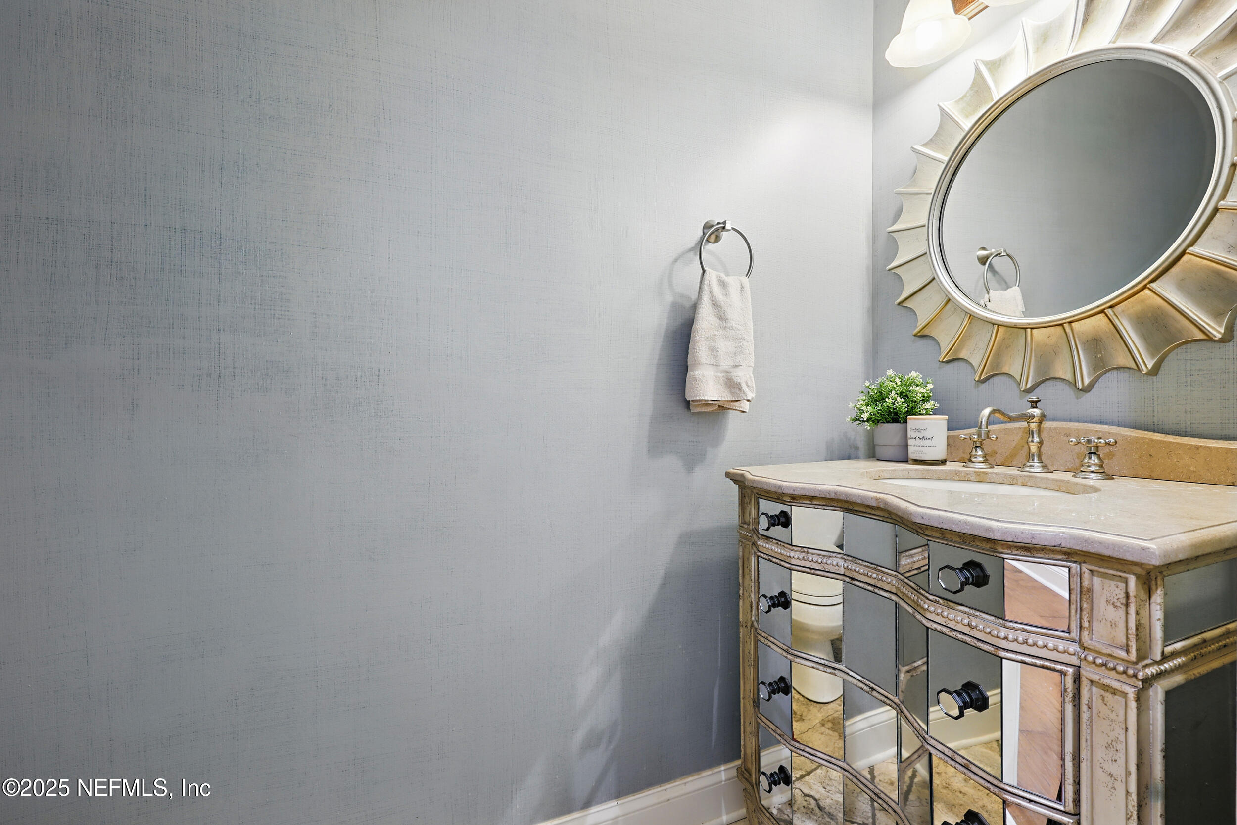 8007 Acorn Ridge Road Jacksonville, FL 32256 - Photo 52 of 76 a bathroom with a sink and a mirror