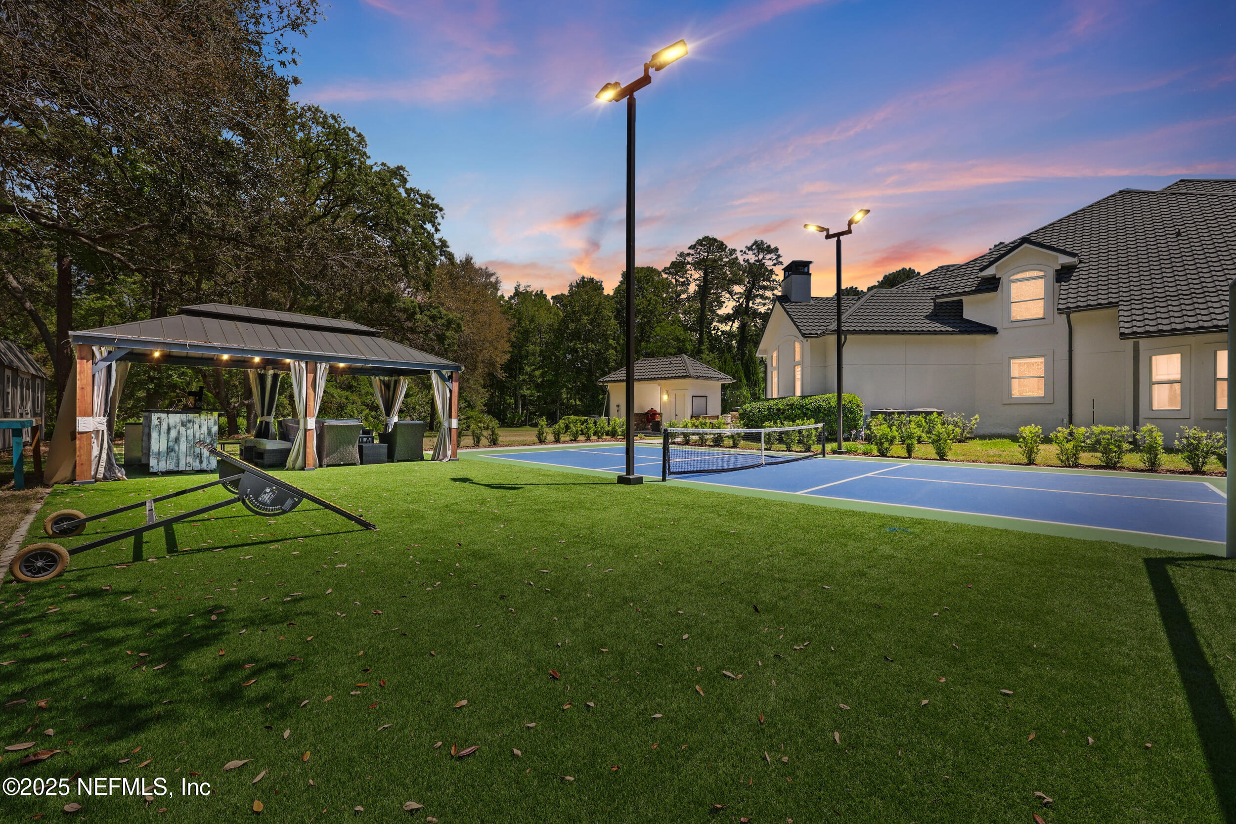 8007 Acorn Ridge Road Jacksonville, FL 32256 - Photo 67 of 76 a view of a house with a big yard and potted plants