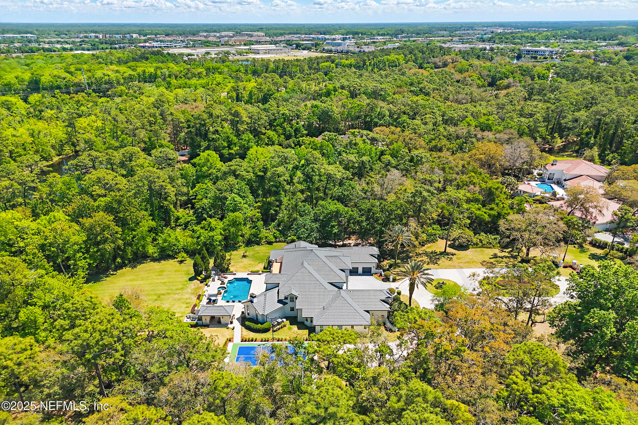 8007 Acorn Ridge Road Jacksonville, FL 32256 - Photo 71 of 76 an aerial view of a house with a yard and lake view