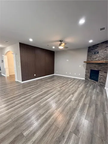 a view of a livingroom with an empty space and a fireplace