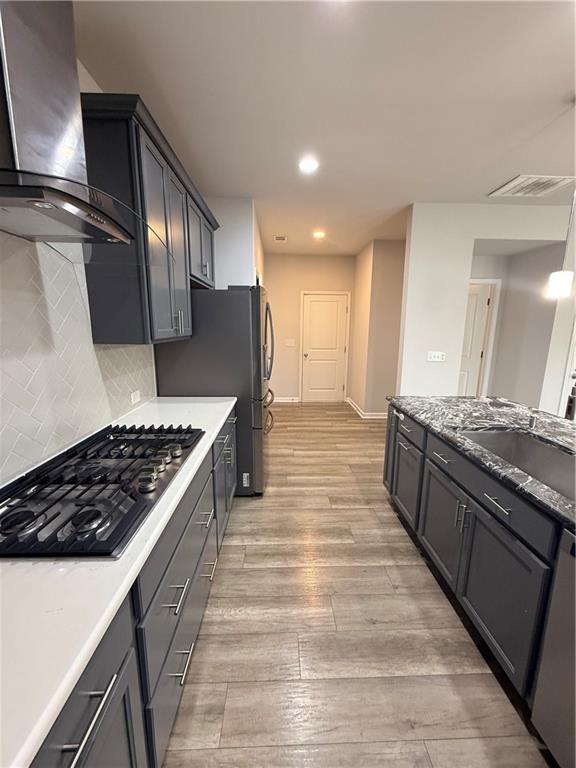 4610 Sandy Creek Drive Cumming, GA 30028 - Photo 18 of 49 a large kitchen with stainless steel appliances and wooden cabinets