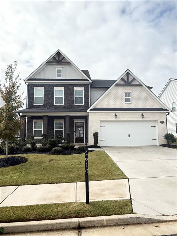 4610 Sandy Creek Drive Cumming, GA 30028 - Photo 2 of 49 a front view of a house with a yard