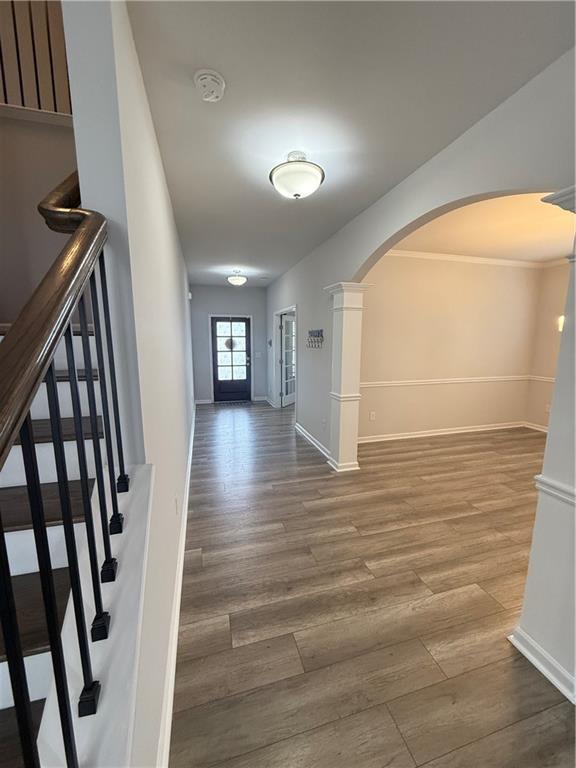 4610 Sandy Creek Drive Cumming, GA 30028 - Photo 23 of 49 a view of a hallway view with wooden floor and staircase