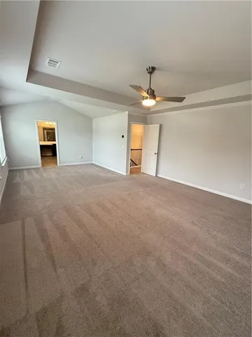 a view of a livingroom with a chandelier fan