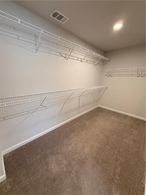 4610 Sandy Creek Drive Cumming, GA 30028 - Photo 33 of 49 a view of a room with racks on the wall