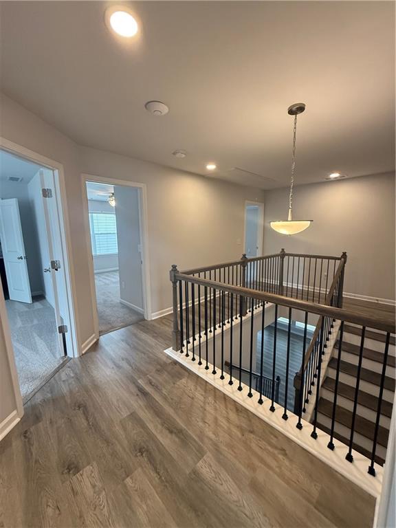 4610 Sandy Creek Drive Cumming, GA 30028 - Photo 35 of 49 a view of a hallway with wooden floor