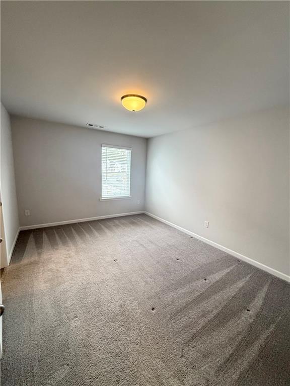 4610 Sandy Creek Drive Cumming, GA 30028 - Photo 36 of 49 an empty room with a window